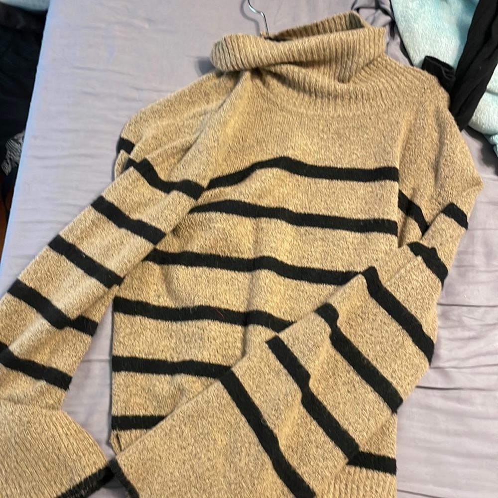 Striped turtleneck sweater with stripes and bell sleeves